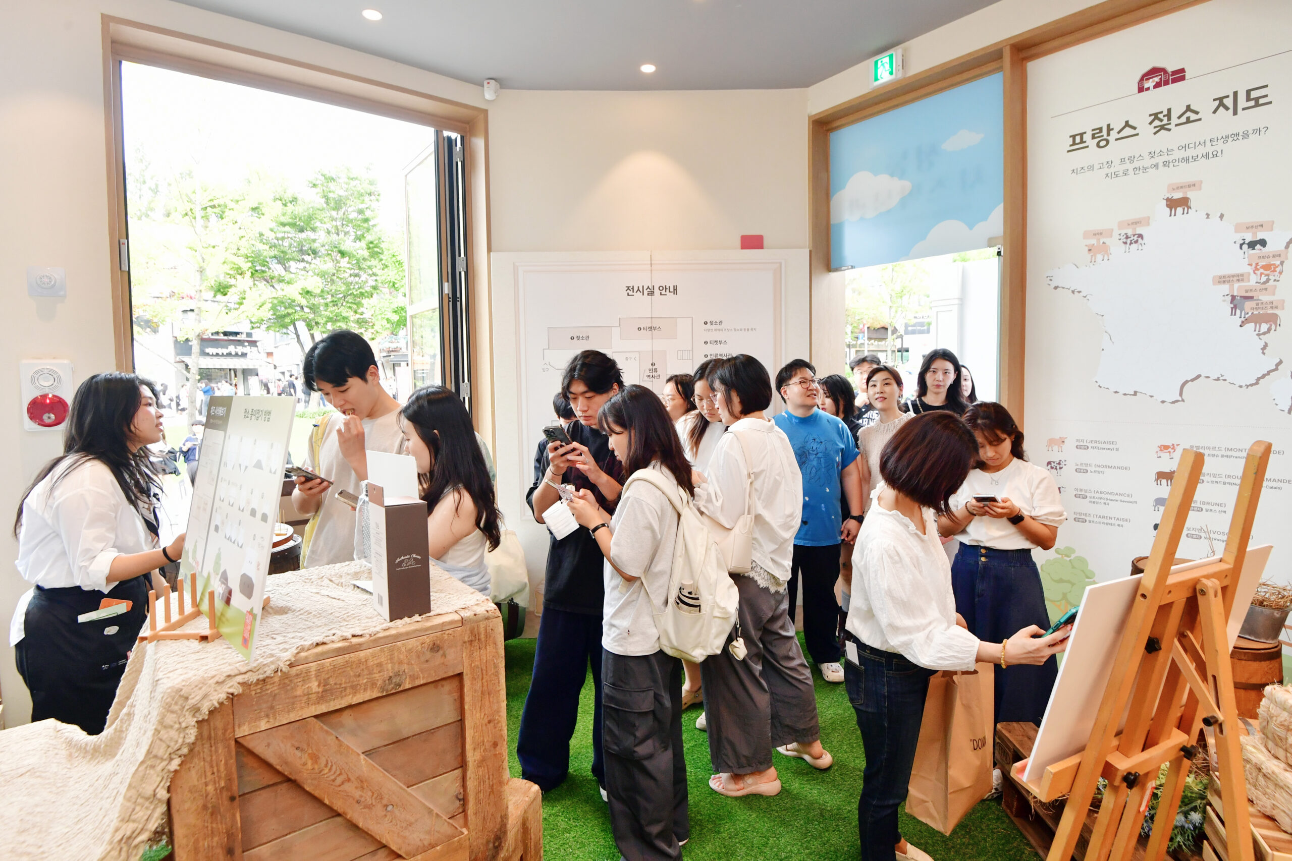 Room full of people at cheese promoting event