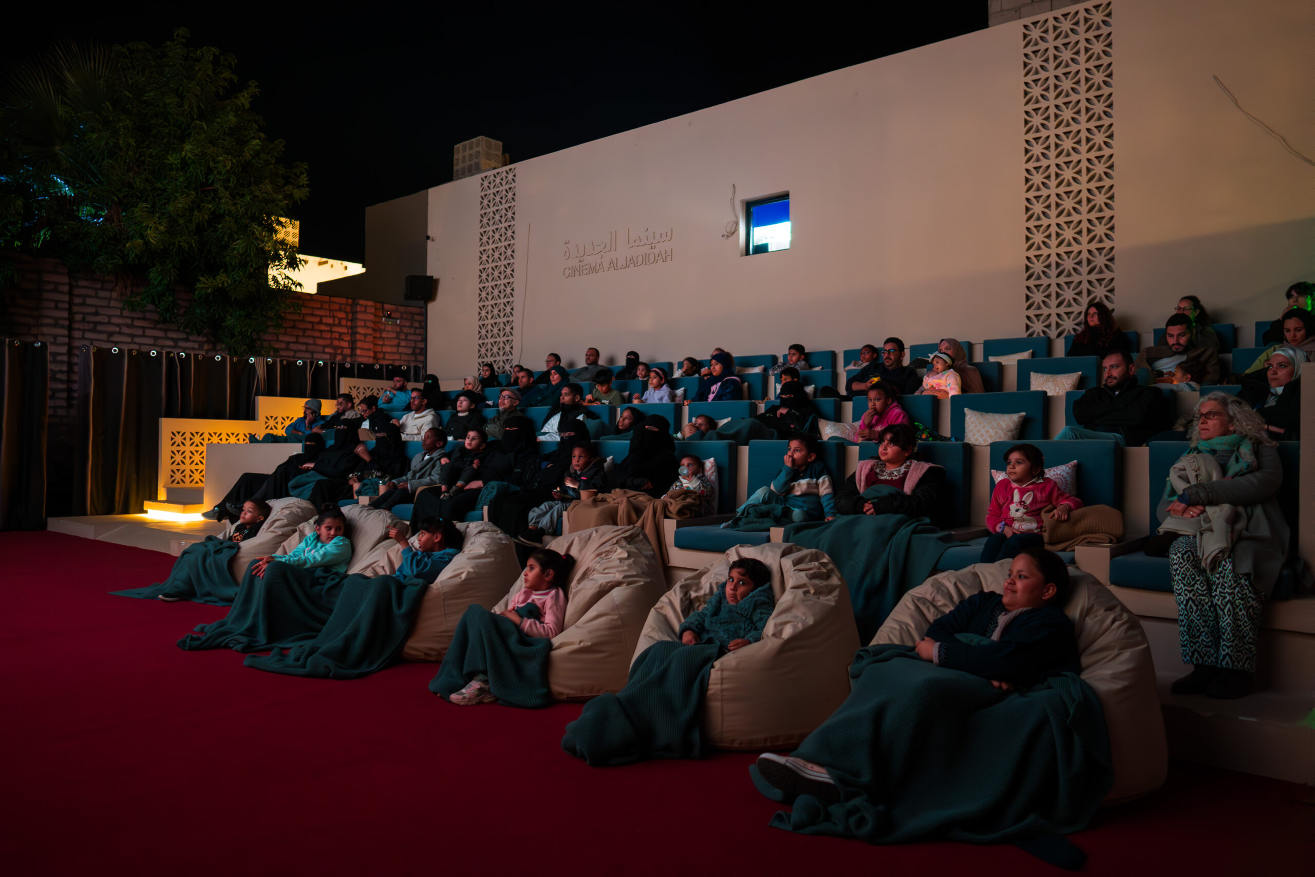 people in bean bags watching a movie