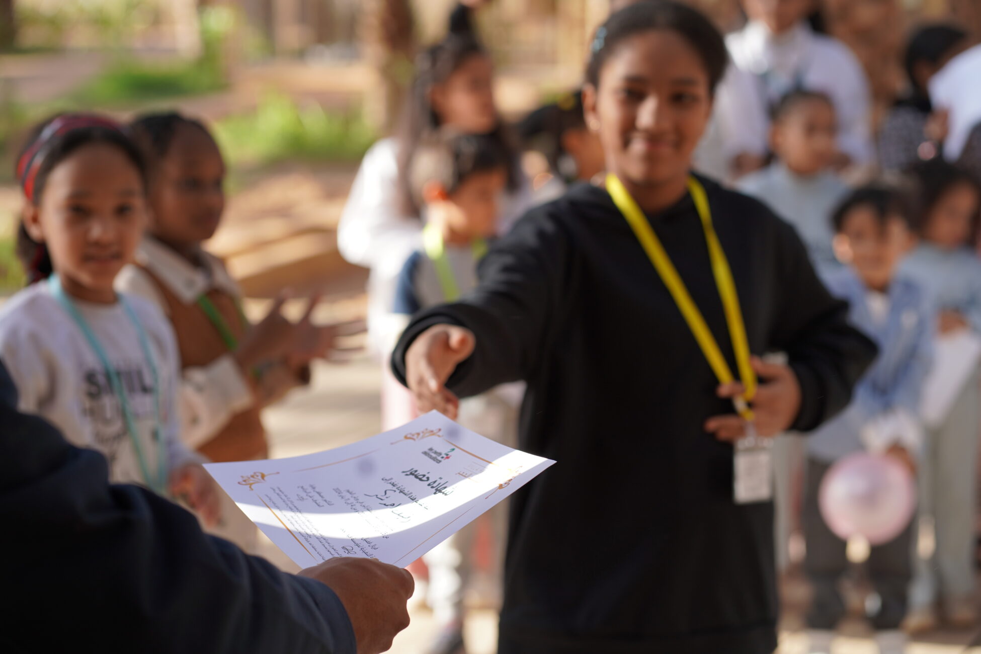 child collecting a certificate