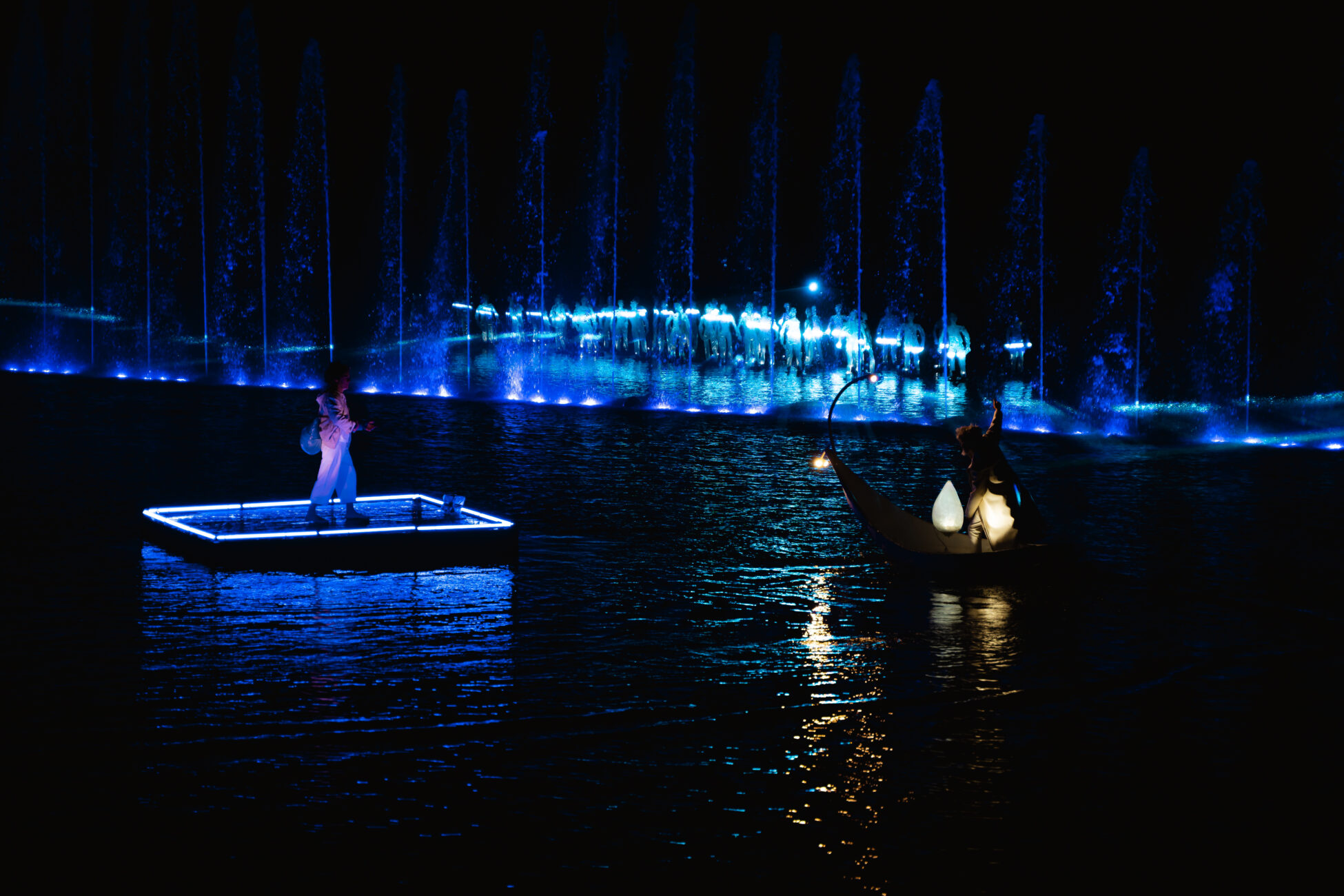 perfomance on water at night with lightshow